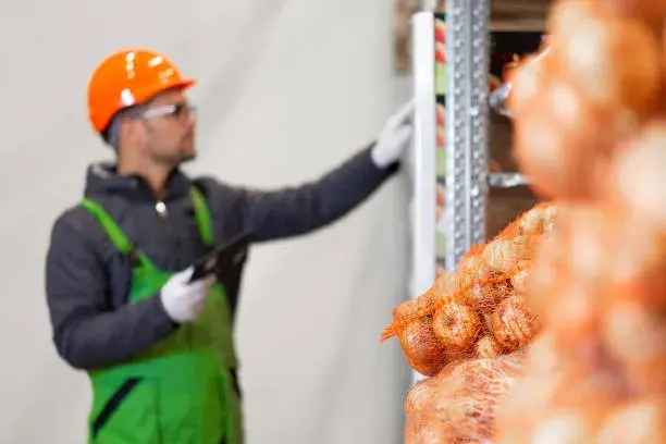 A Man Standing in a Food and Beverage Store (Banner of for Top 8 Important Features of NetSuite ERP for Food and Beverage Industry blog)