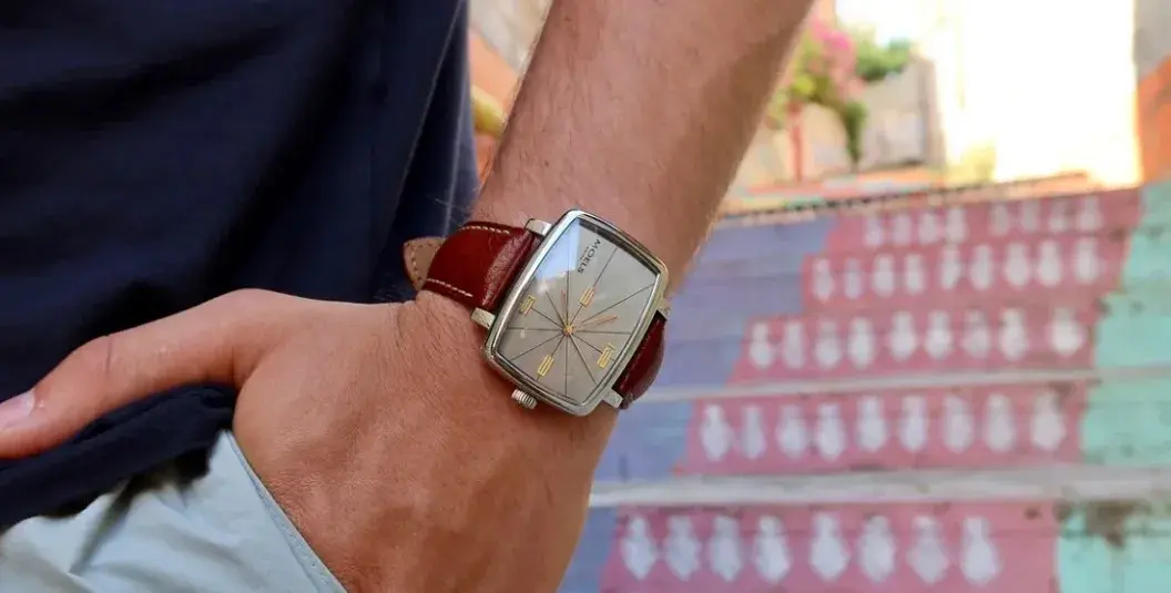 a man wearing a high quality watch of moel & co watch brand