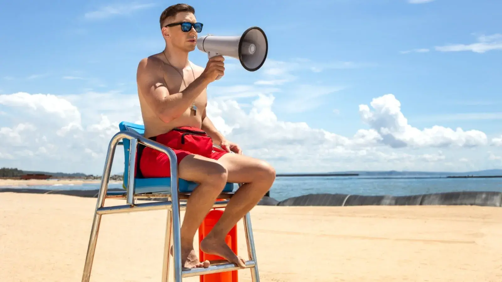 a lifeguard sitting on a chair
