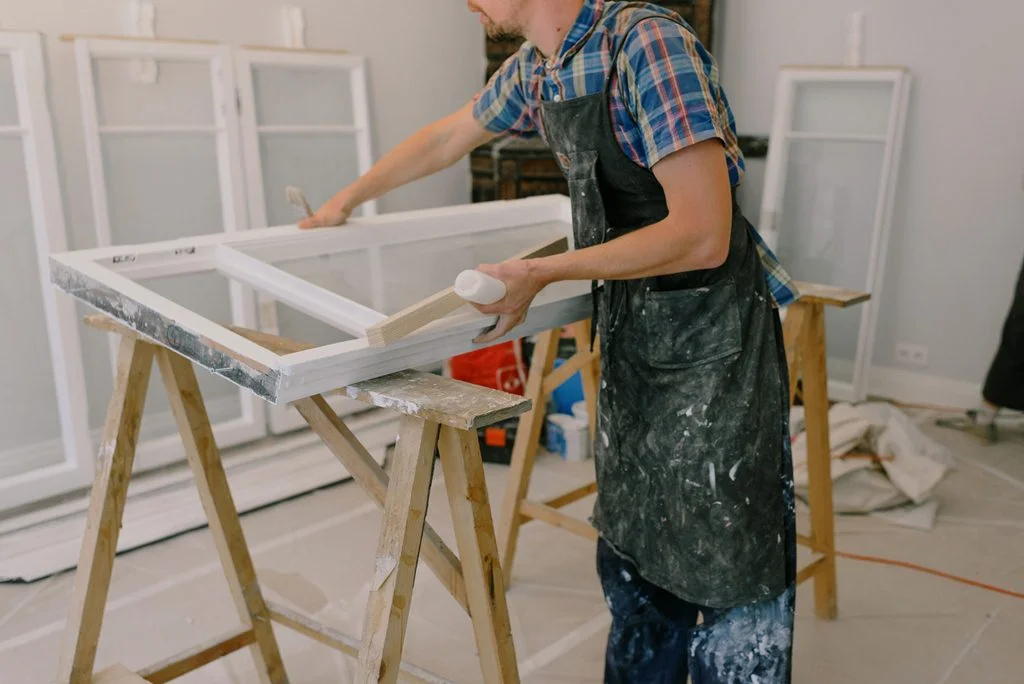 carpenter repairing window