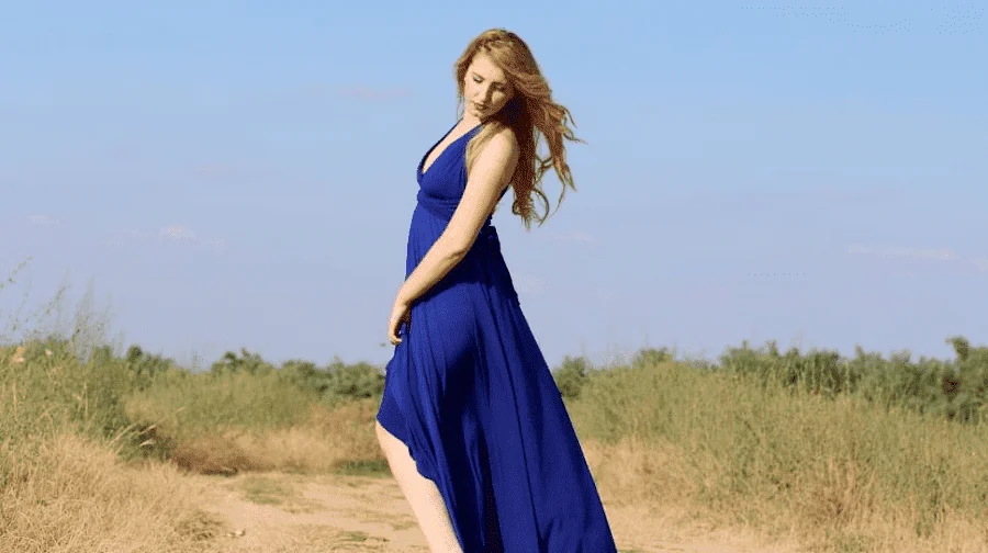 A Woman Wearing A Blue High-Low Dress