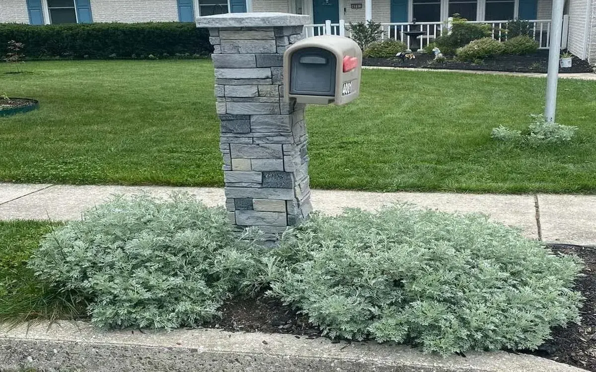 mailbox covered with slate and genstone